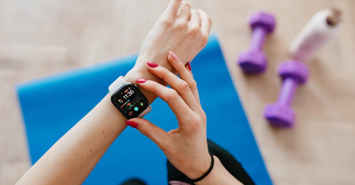 A fitness watch and yoga mat.