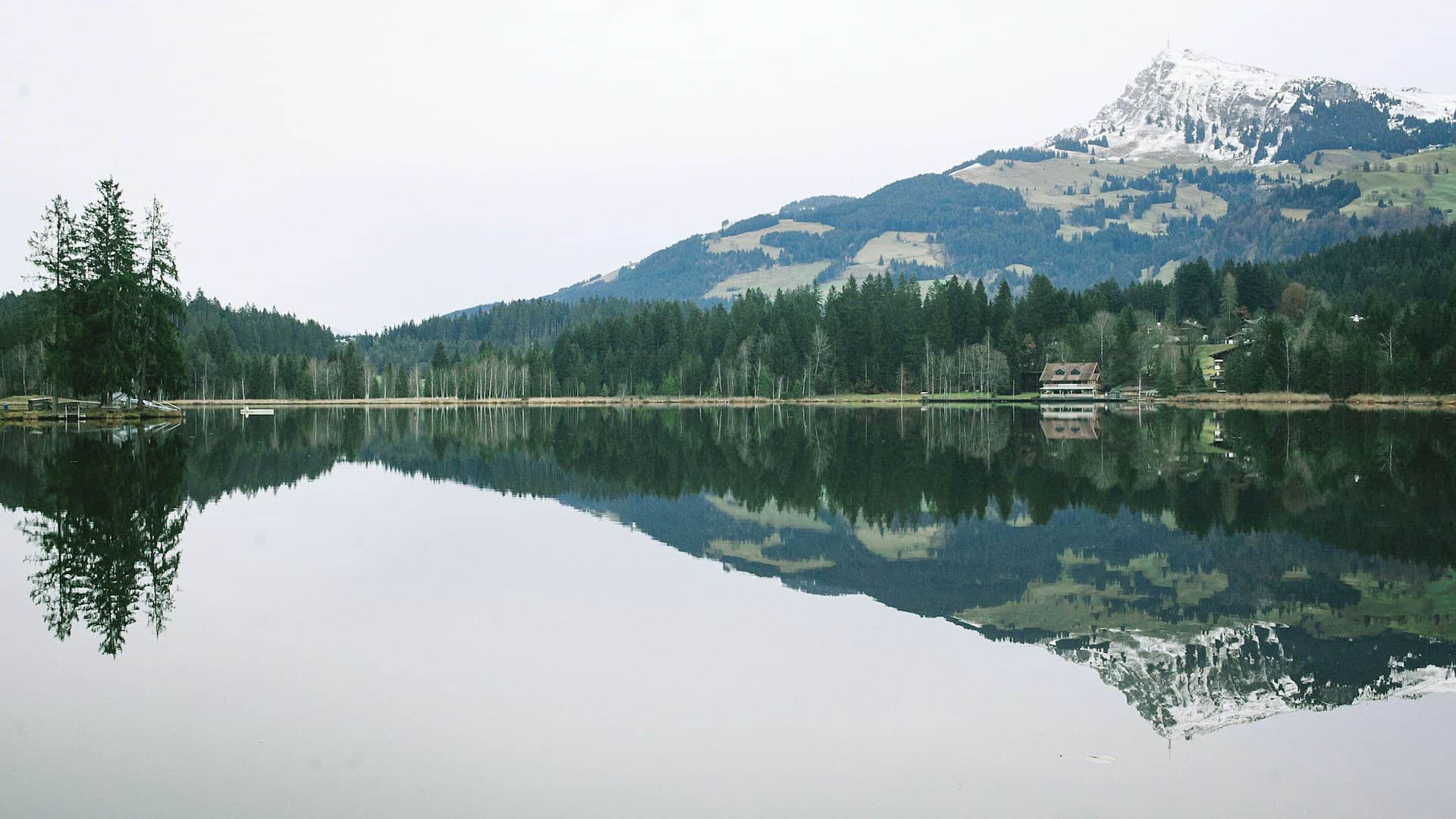 A serene landscape with mountains and a calm lake, symbolizing peace and mental clarity.