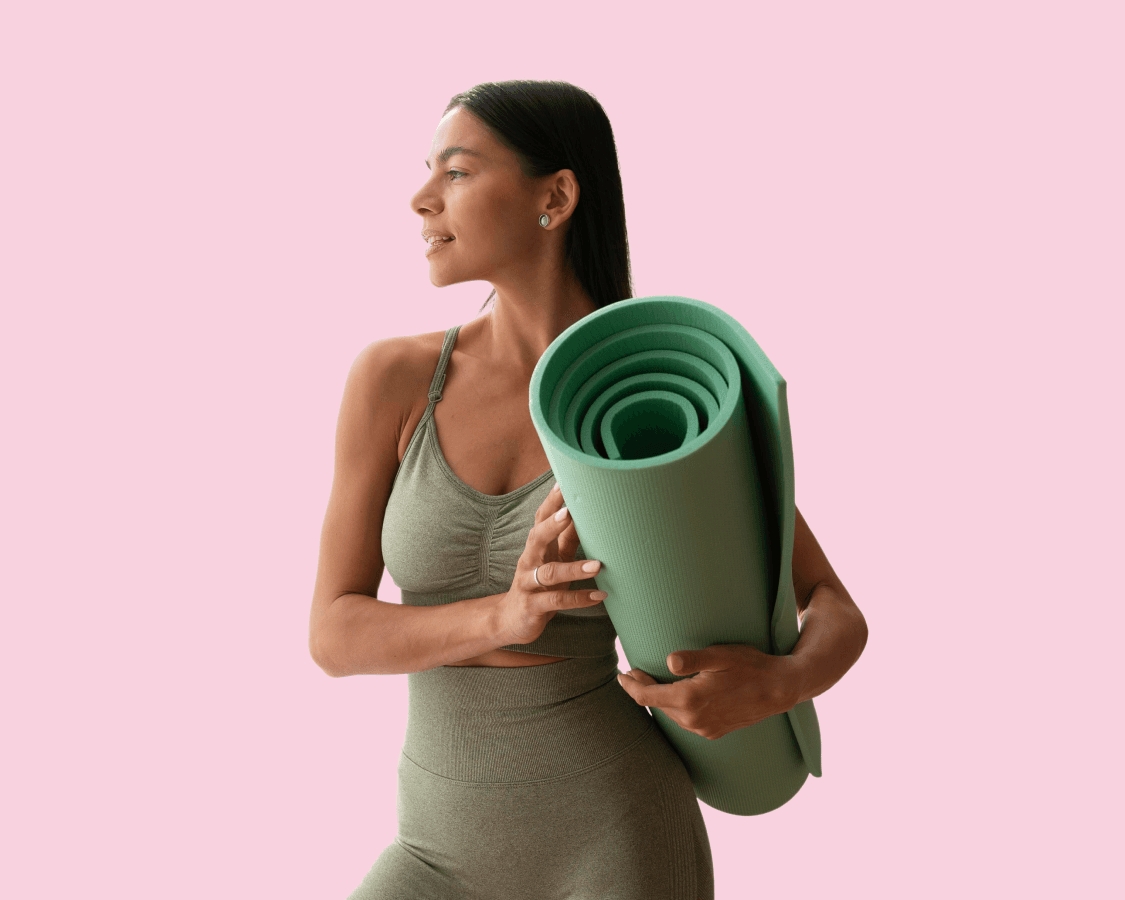a woman and a yoga mat