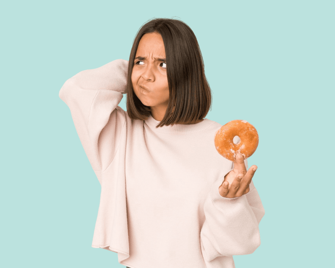 woman thinks if she should eat a douhgnut 