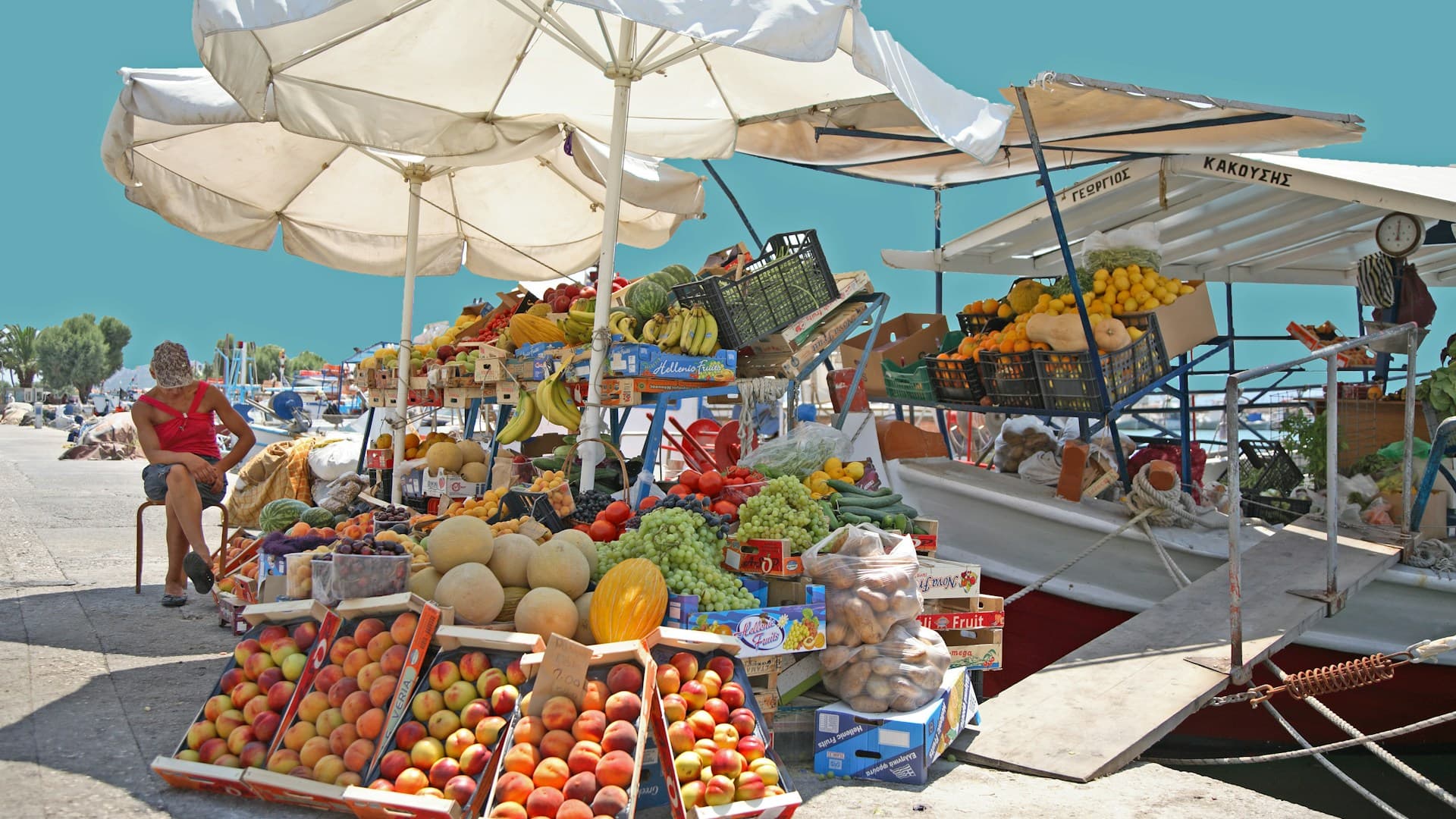 A vibrant, colourful spread of Mediterranean diet foods including fresh vegetables, olive oil, fish, and whole grains.