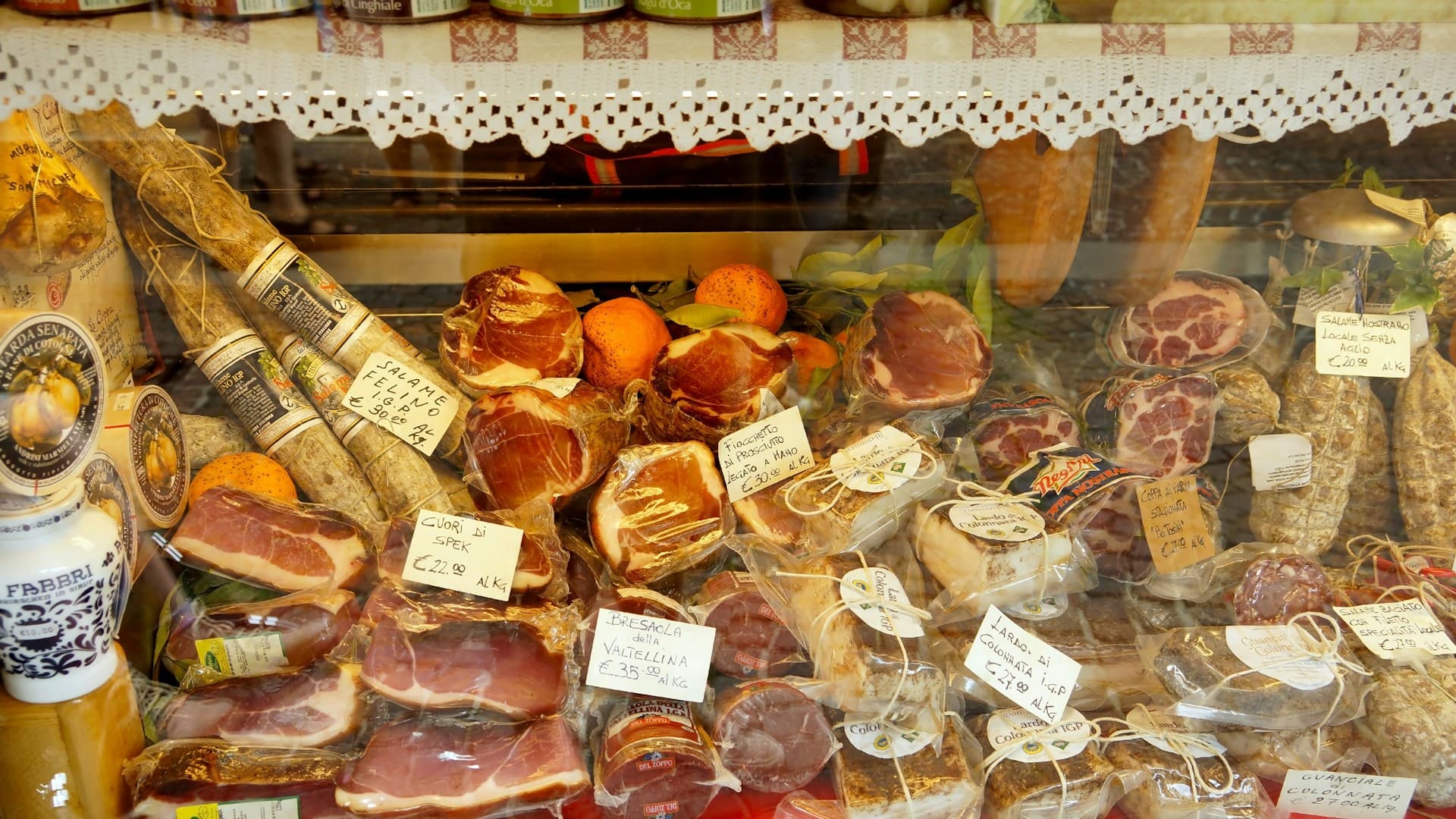 A visual comparison showing processed foods like pastries and red meat on one side, and healthy Mediterranean alternatives like fruits and nuts on the other.