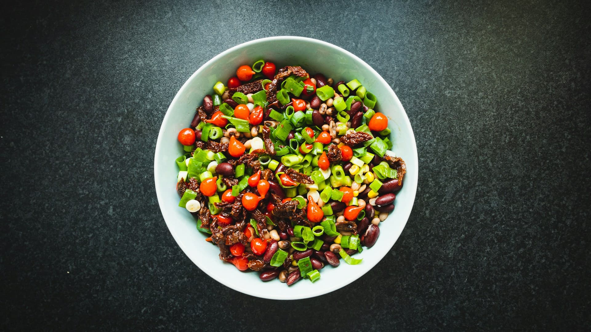 Colourful bowl of Mediterranean bean salad
