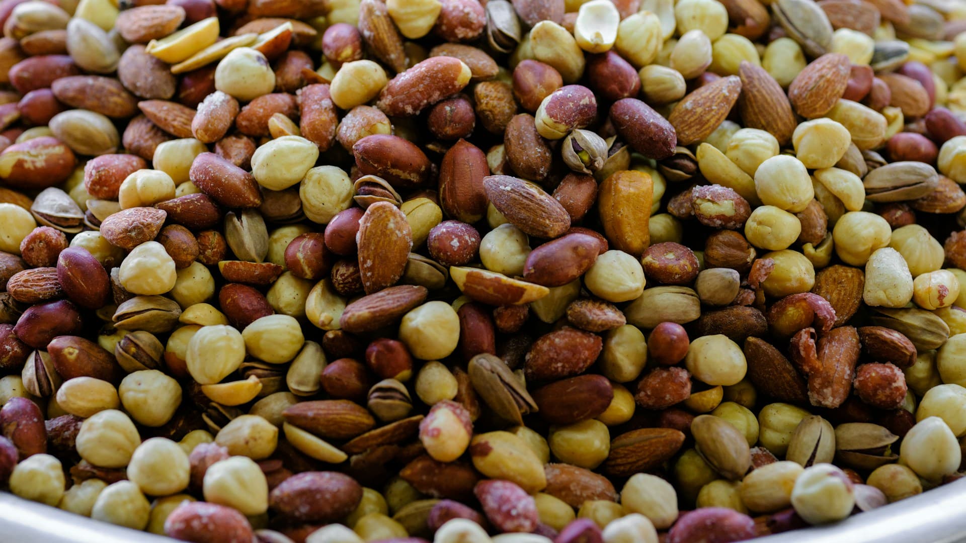 Various types of dried beans and lentils in bowls.